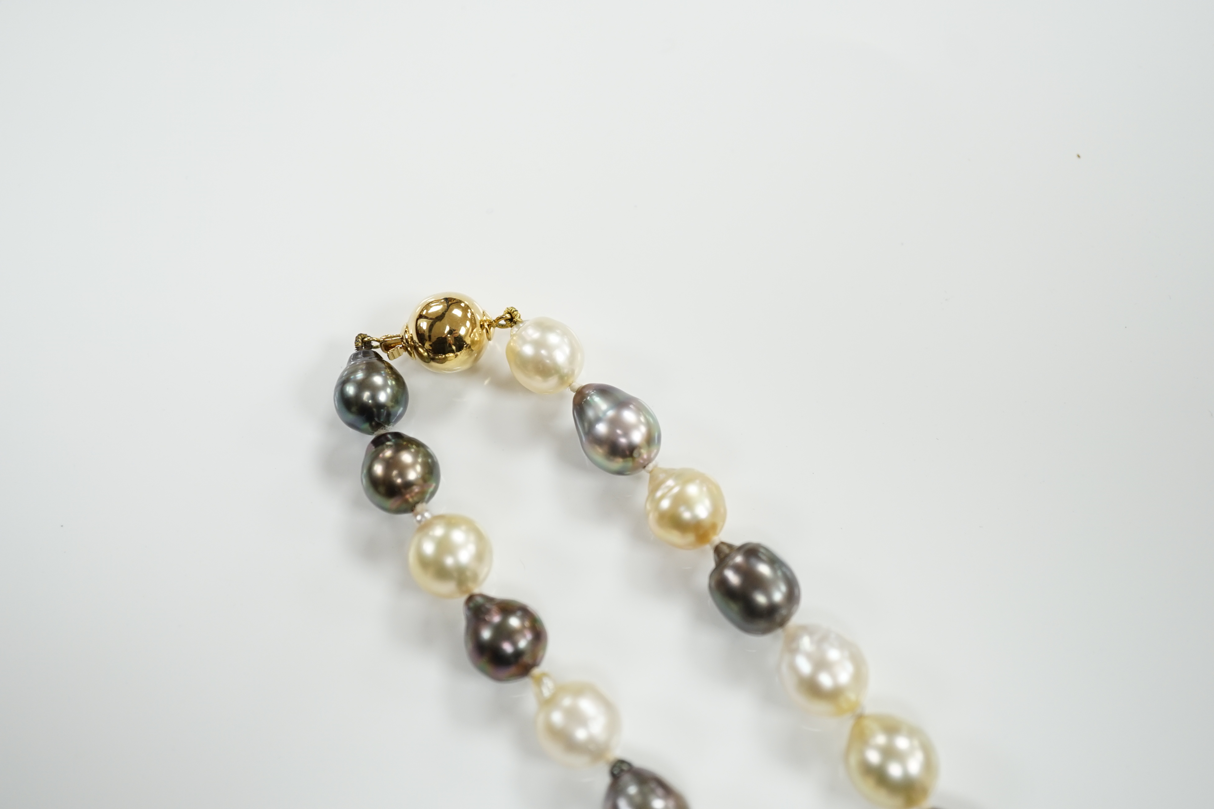 A modern single strand cultured South Sea cultured baroque pearl necklace, with 18ct gold spherical clasp, 42cm, with box.